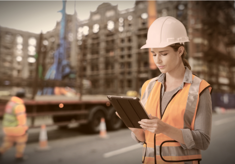 Female construction worker using tablet