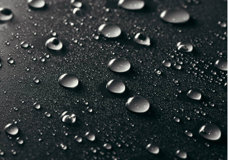 Water drops on grey background.